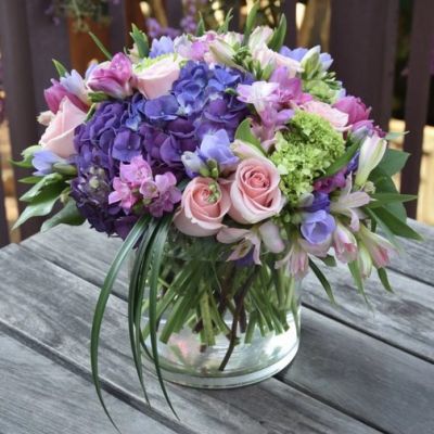 This sweet design of purples, lavenders and pinks is sure to put a smile on your love's face.