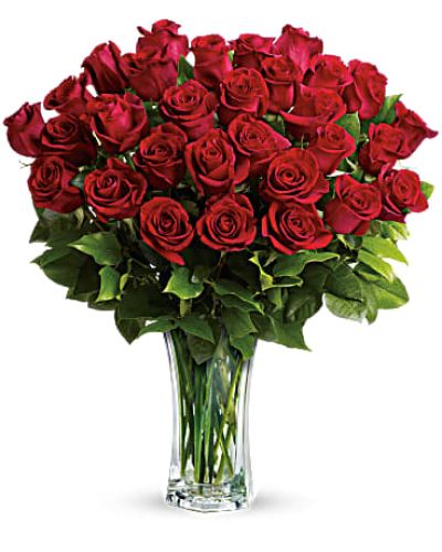 <p>Shout your love from the rooftops with long stemmed red roses artistically arranged in a cut crystal vase. These red roses make a spectacular romantic bouquet. She'll be yours forever.<br />
Standard- 24 Elegant Roses<br />
Deluxe-30 Beautiful Blooms<br />
Premium-36 Exquisite Roses</p>