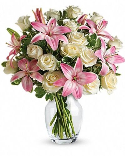 <div class="m-pdp-tabs-description">
<div id="mark-3" class="m-pdp-tabs-marketing-description">A romantic gift like this one is always appreciated. An eye-catching display of roses and lilies is perfectly arranged in a feminine vase which makes a beautiful and lasting impression.</div>
</div>
<p id="arrngDescp">Elegant white roses and sweet pink asiatic lilies are hand-arranged with greens. It's the perfect way to show you love them always and forever.</p>