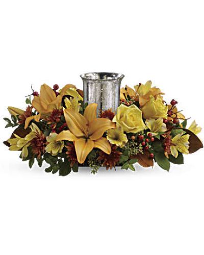 <div id="mark-3" class="m-pdp-tabs-marketing-description">A fabulous centerpiece for any fall occasion, this arrangment's glass hurricane shimmers and shines within a lush arrangement of roses and lilies.</div>
&nbsp;
<div id="desc-3">
<ul>
 	<li>This beautiful arrangement features yellow roses, peach asiatic lilies, yellow alstroemeria, bronze cushion chrysanthemums, seeded eucalyptus, huckleberry and orange berries.</li>
</ul>
</div>