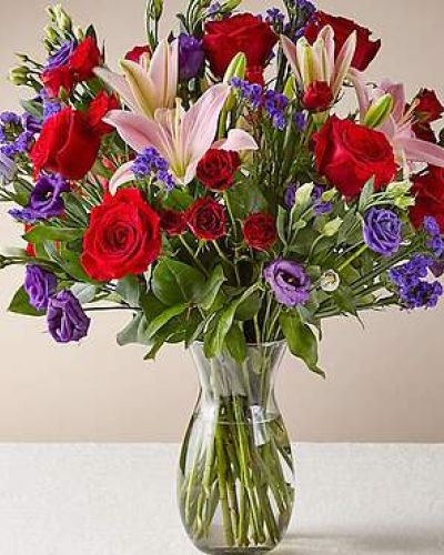 This dreamy jewel toned bouquet combines bold color and eye catching texture to make a statement. Featuring a thoughtful array of both roses and lilies, this dazzling assortment is bound to impress your recipient.

STANDARD

C Quantity Color Description
5 Red 50 cm Standard Rose
2 Pink LA Hybrid Lily
1 Purple Lisianthus - Double
3 Red Spray Rose
3 Purple Filler - Sinuata Statice
3 Green Green - Salal Tips

DELUXE

C Quantity Color Description
7 Red 50 cm Standard Rose
2 Pink LA Hybrid Lily
5 Purple Lisianthus - Double
5 Red Spray Rose
3 Purple Filler - Sinuata Statice
3 Green Green - Salal Tips

PREMIUM
C Quantity Color Description
10 Red 50 cm Standard Rose
3 Pink LA Hybrid Lily
6 Purple Lisianthus - Double
5 Red Spray Rose
3 Purple Filler - Sinuata Statice
3 Green Green - Salal Tips