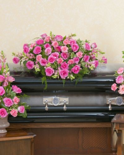 <p>Casket spray, standing spray and urn design in peaceful pink colors.</p>