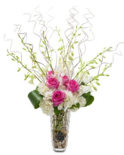 Standout with Wisps of Wonder, a stunning display of hot pink roses, white hydrangea and orchids.